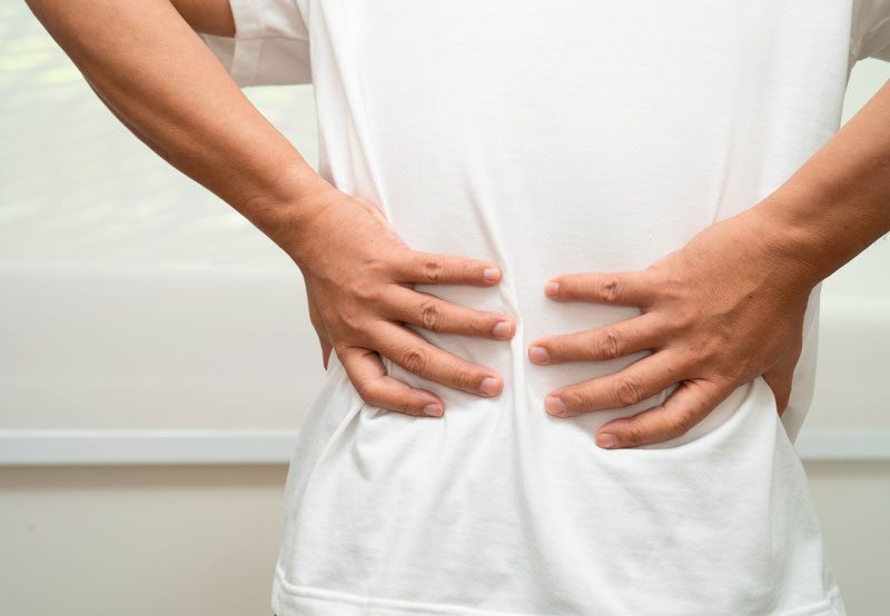 Person-holding-lower-back Person-holding-lower-back